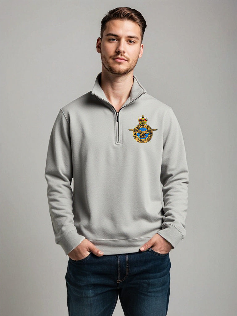Male model wearing light grey Royal Air Force quarter-zip sweatshirt with embroidered RAF crest – stylish and comfortable military-inspired pullover for RAF veterans, personnel, and supporters.