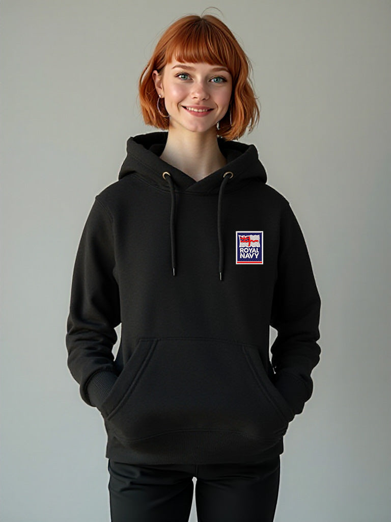 Female model in a black hoodie embroidered with the Royal Navy logo on the left breast, shown in a relaxed pose.
