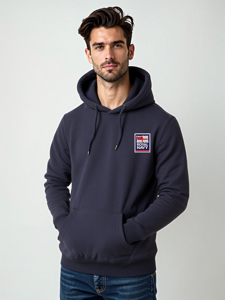 Male model wearing a navy hoodie with the Royal Navy badge embroidered on the left chest, standing in a casual posture.