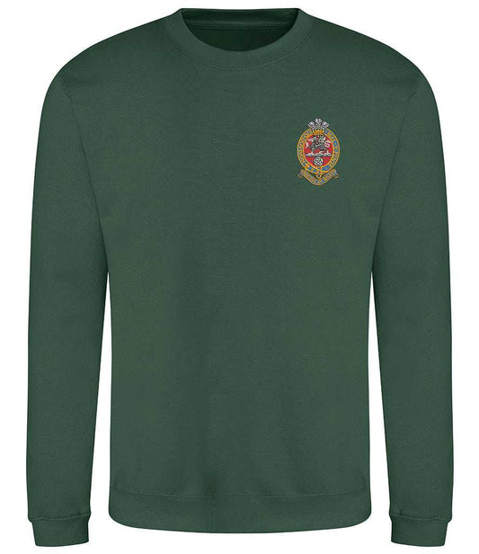 Green sweatshirt with embroidered Princess of Wales's Royal Regiment emblem.