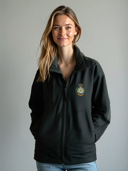 “Smiling female model wearing a women’s Royal Engineers black softshell jacket with stand-up collar, full-length front zipper, chest zip pocket, side hand pockets and Royal Engineers Logo embroidered on left breast.”