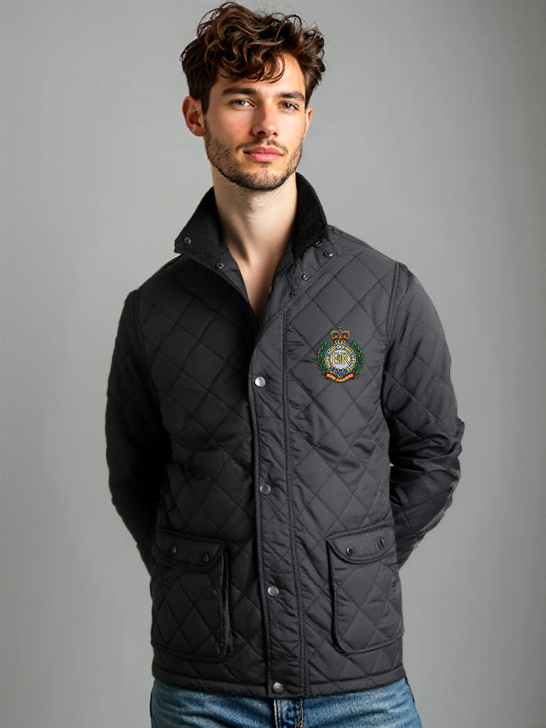 “Male model wearing a men’s Royal Engineers black diamond-quilted field jacket with fleece-lined stand collar, snap-front closure, flap and side-entry pockets, featuring the embroidered Royal Engineers logo on the left chest.”