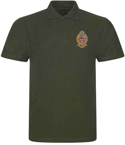 Green Queens Regiment polo shirt with embroidered emblem, ribbed collar, and three-button placket, made from 50% polyester and 50% cotton.