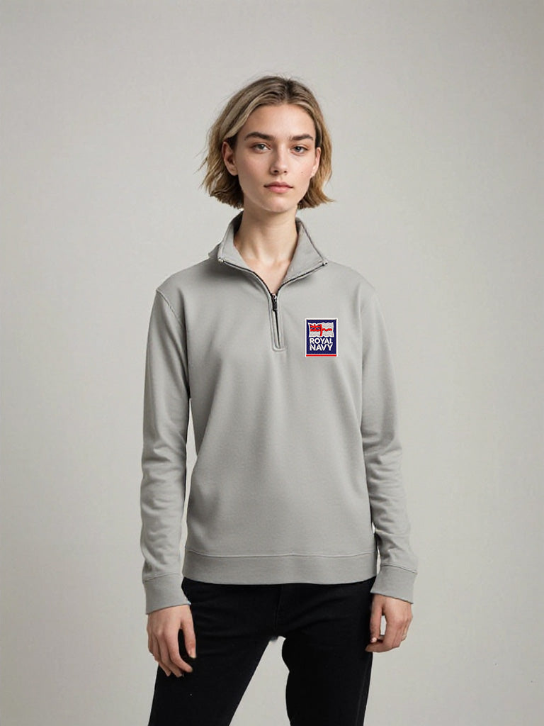 Female model wearing grey Royal Navy quarter-zip sweatshirt with official embroidered logo, casual military-inspired pullover for women, standing against neutral background.