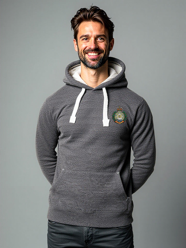 Man wearing a black melange hoodie with a Royal Engineers crest on the left chest, white drawstrings, and a front pouch pocket, standing against a neutral grey background.