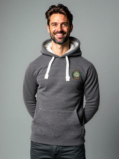 Man wearing a black melange hoodie with a Royal Engineers crest on the left chest, white drawstrings, and a front pouch pocket, standing against a neutral grey background.