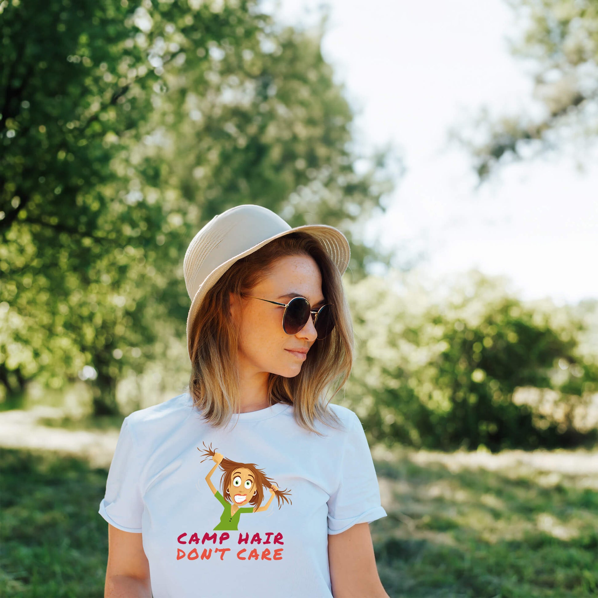 Embrace the Wild with our "Camp Hair Don't Care" Graphic T-Shirt - Your Go-To Outdoors Companion!