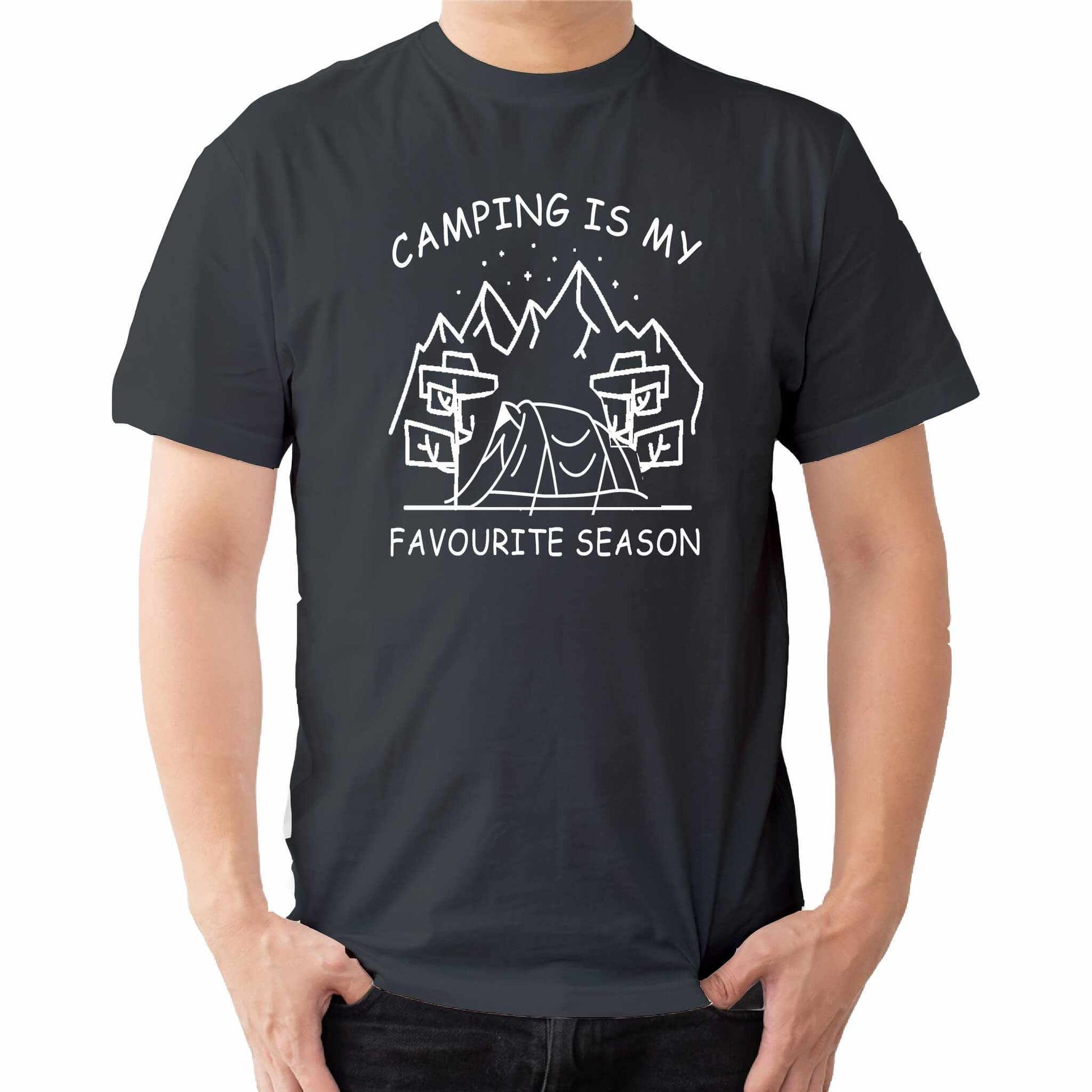  "Grey Graphic tee with an illustration of a tent, surrounded by nature. Text reads: 'Camping is my favorite season.' Celebrate the great outdoors!"