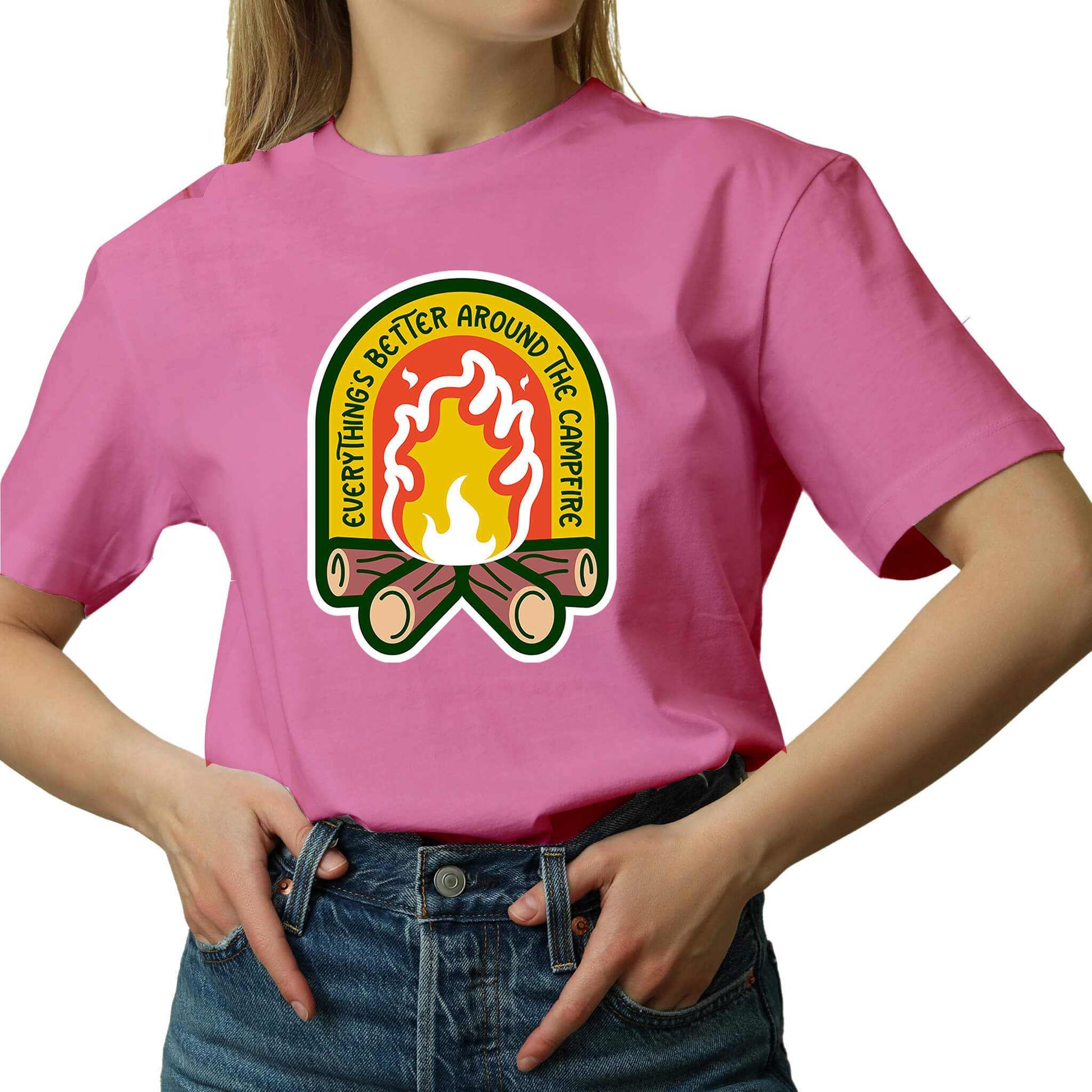 "Pink Cozy tee featuring a campfire image, perfect for outdoor enthusiasts. Text says: 'Everything is better around the campfire.' Embrace the warmth and camaraderie!"