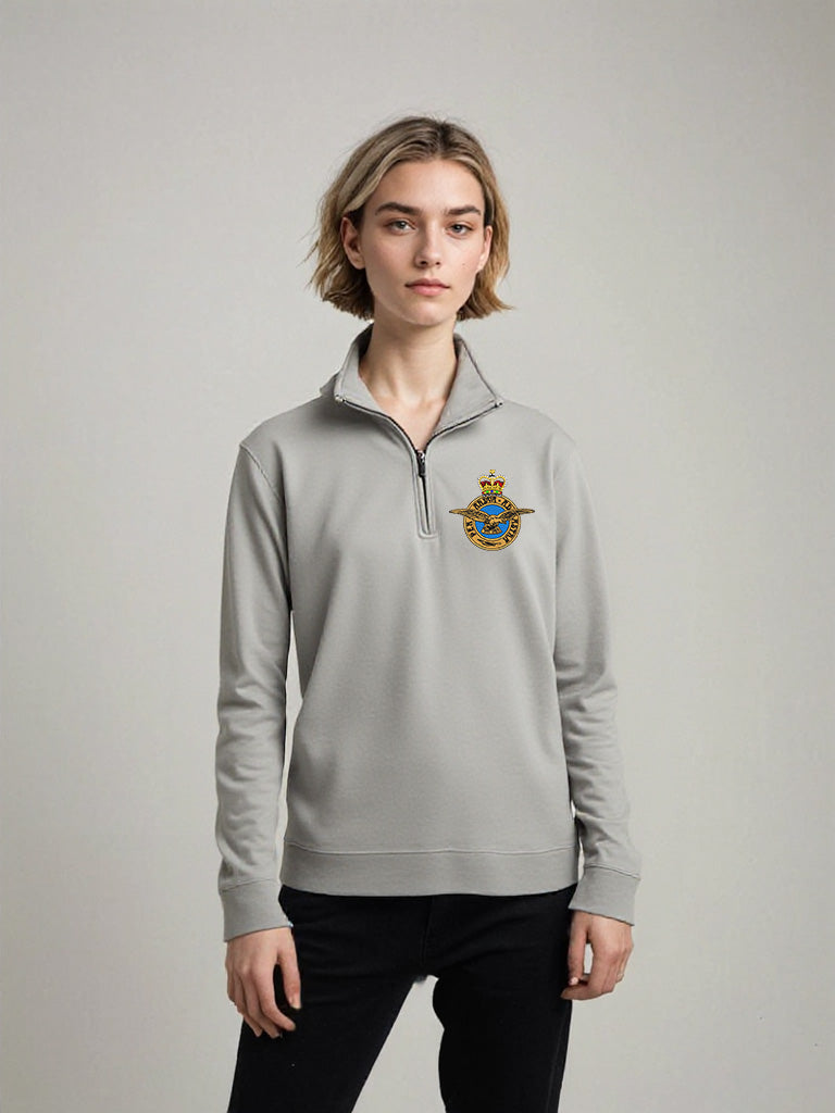 Female model wearing light grey Royal Air Force quarter-zip sweatshirt with embroidered RAF crest – casual military-style pullover for RAF supporters, veterans, and comfortable everyday wear.