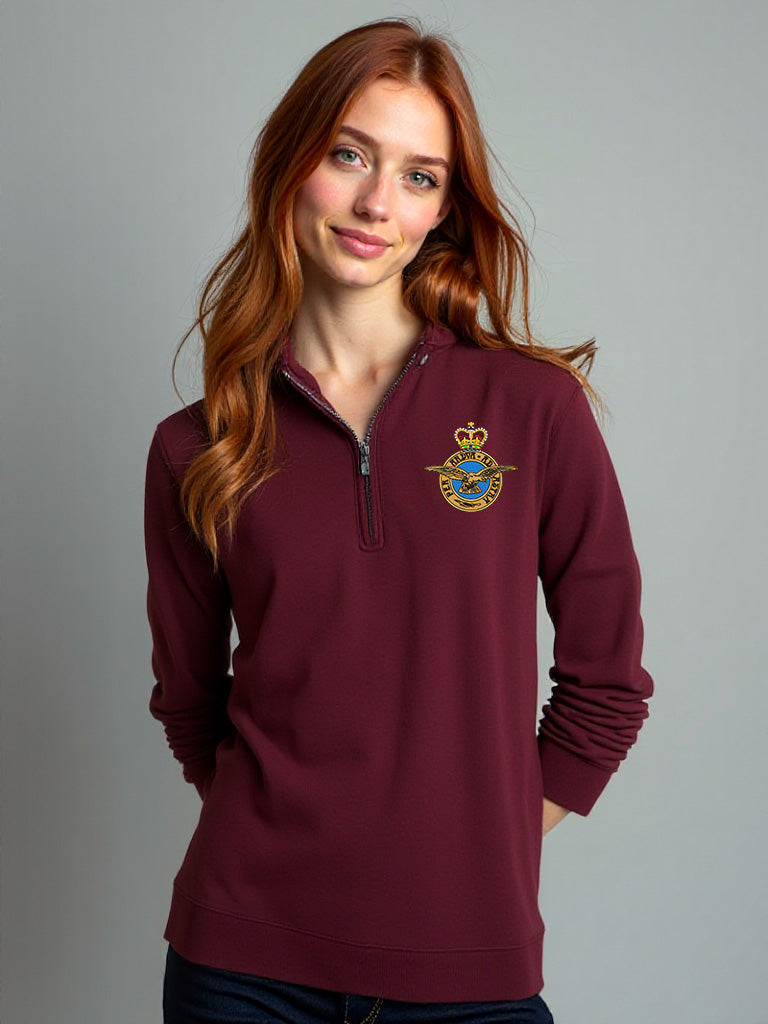 Female model wearing maroon Royal Air Force quarter-zip sweatshirt with embroidered RAF crest – military-style women’s pullover for RAF veterans, aviation enthusiasts, and everyday comfort.