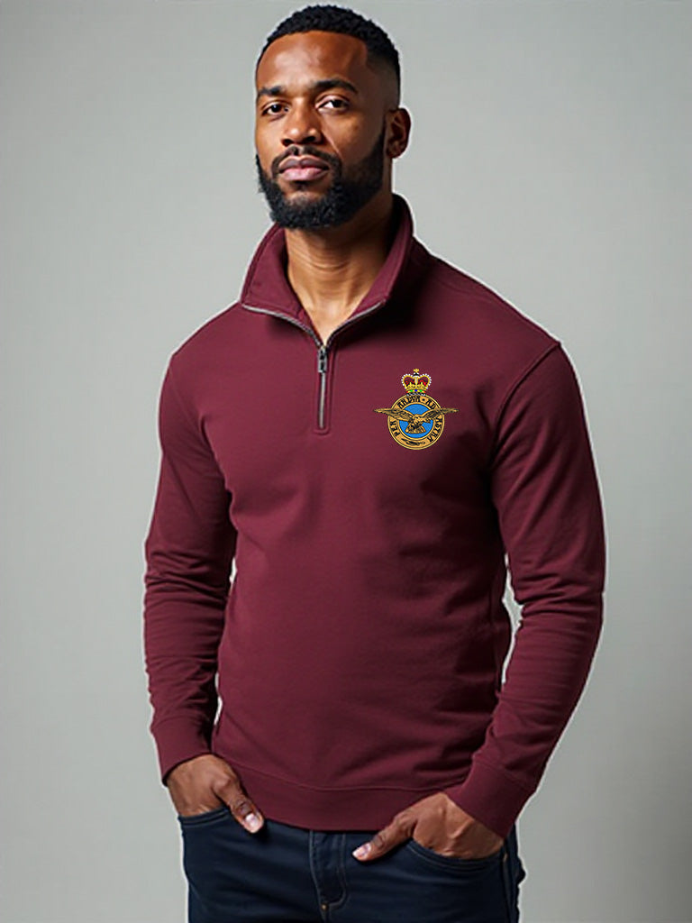 Male model wearing maroon Royal Air Force quarter-zip sweatshirt with embroidered RAF crest – premium military-style pullover for RAF veterans, personnel, and aviation supporters.