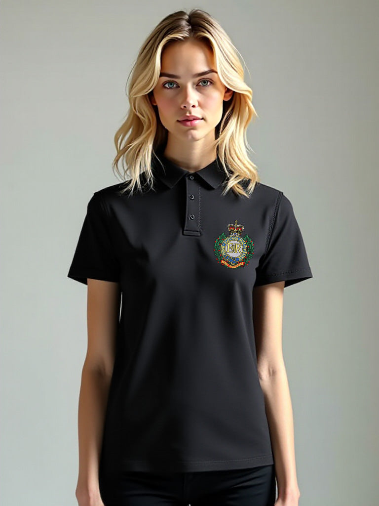 Female model wearing black Royal Engineers polo shirt with embroidered crest on front left chest and bold Sapper logo printed on the back, short sleeves, button-up collar, official military-style apparel.