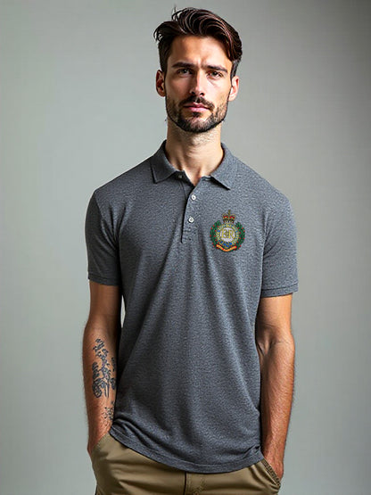 Male model wearing charcoal Royal Engineers polo shirt with embroidered crest on left chest, short sleeve design, smart-casual fit, Sapper logo printed on the back.