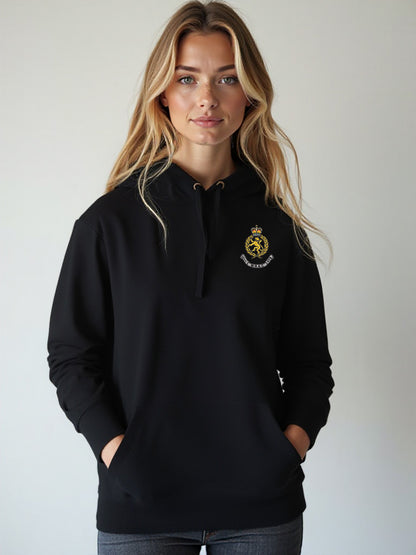 Female model in a black WRAC hoodie featuring a waffle-lined hood and embroidered WRAC logo on the left chest.