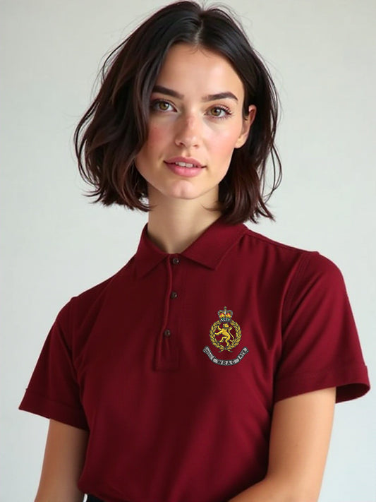 Female model wearing a maroon WRAC polo shirt with the WRAC crest embroidered on the left chest, posed facing forward against a neutral background.